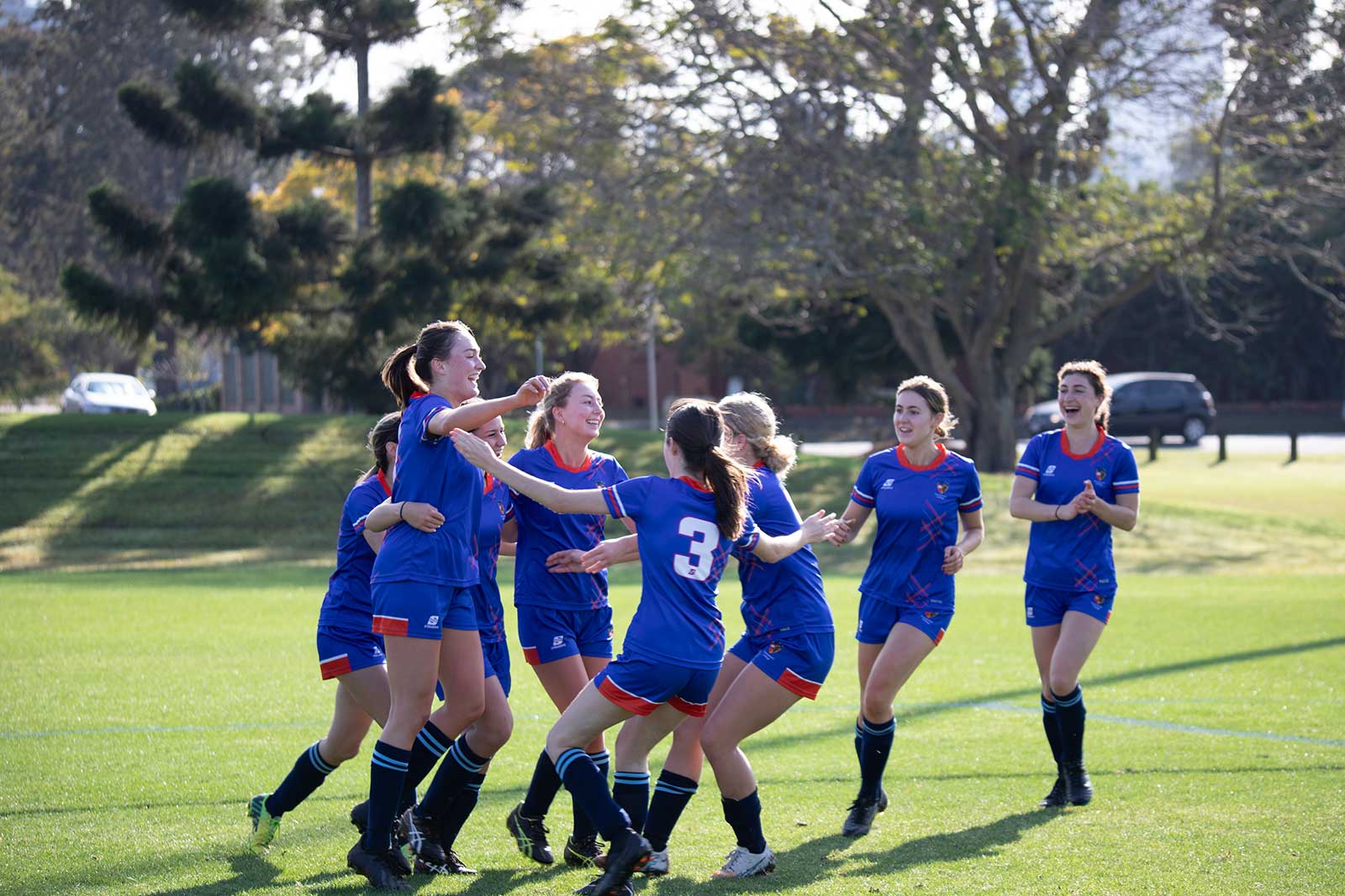 Photo of members of women's soccer team celebrating